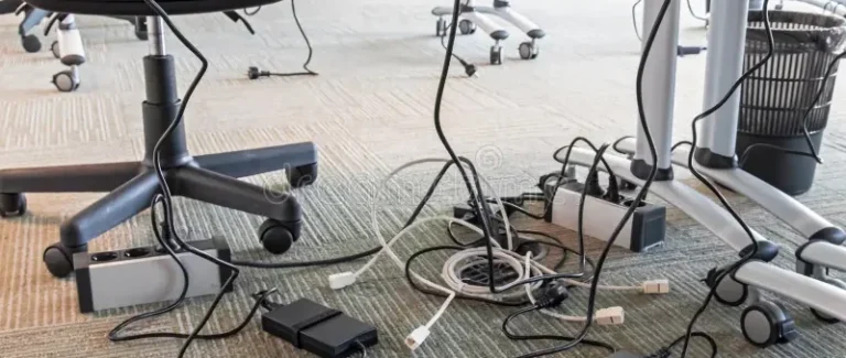Tangled cables under desk